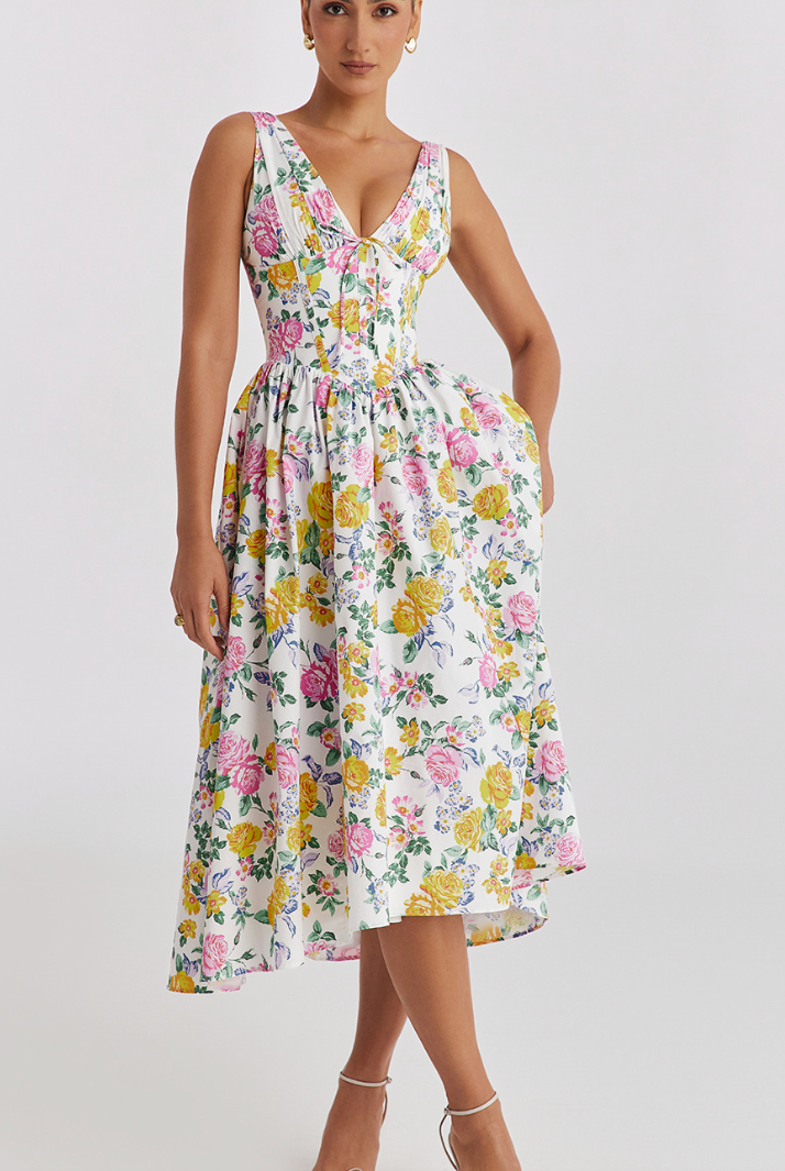 Yellow floral sleeveless mini evening dress with V-neck from Lumina Vancouver, perfect for elegant occasions.