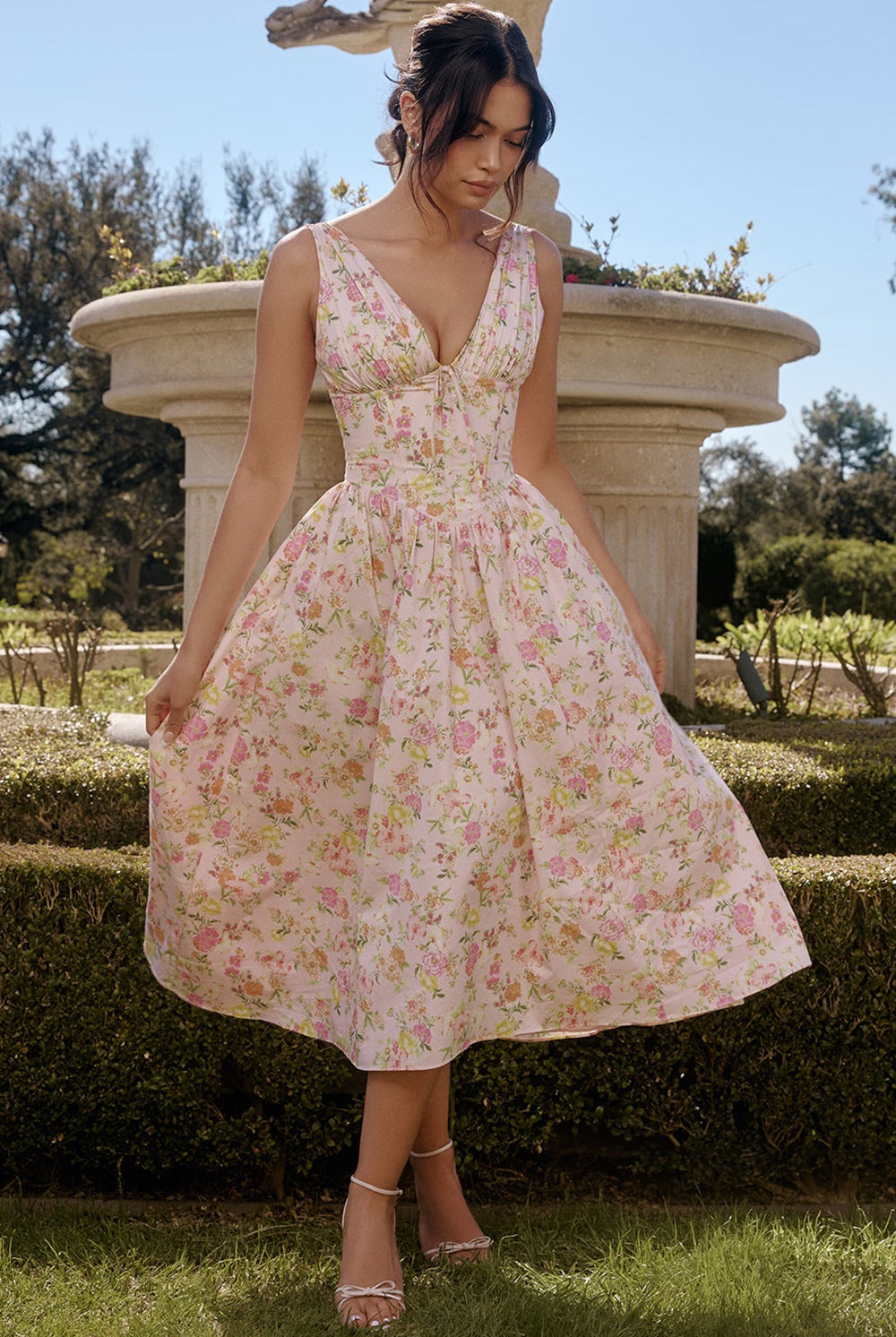 Yellow sleeveless Nova evening dress with V-neck and floral pattern by Lumina Vancouver, styled as a mini dress.