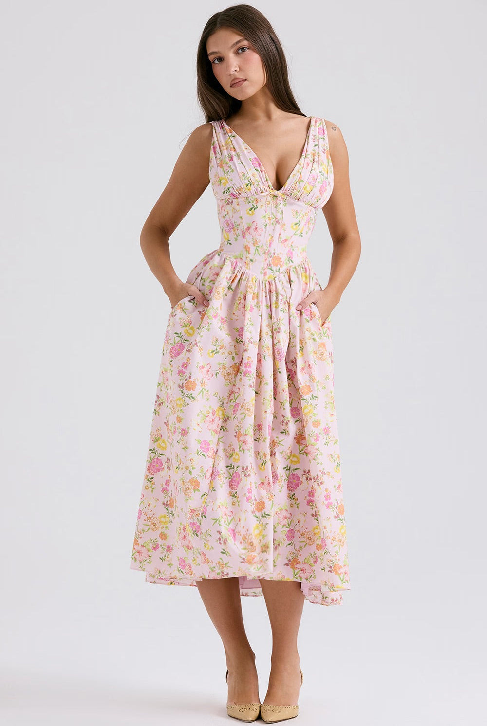 Yellow sleeveless Nova evening mini dress with V-neck and floral pattern by Lumina Vancouver.