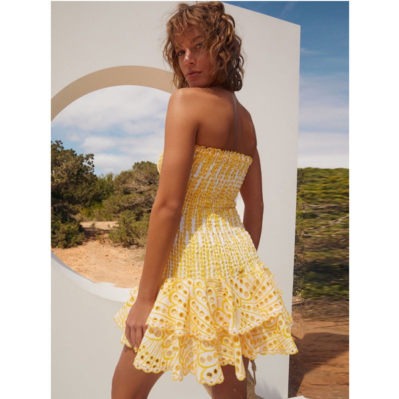Yellow Seraphina strapless mini dress by Lumina Vancouver, shown on a model, highlighting its fitted silhouette and stylish design.