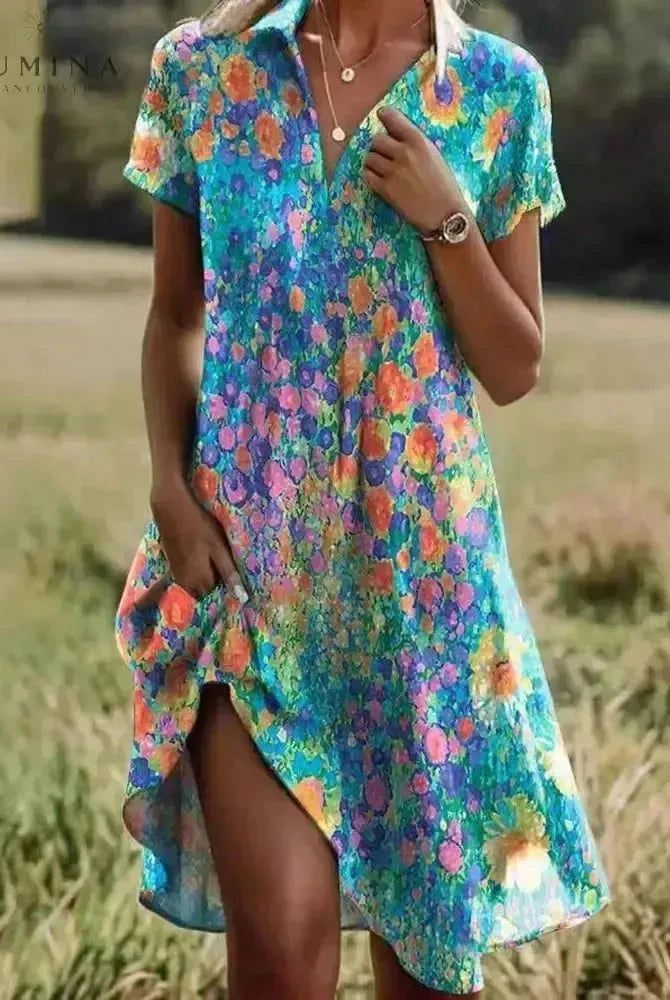 Lumina Wear Onerva boho vintage v-neck dress with floral pattern and flowing fabric, perfect for casual and bohemian styles.