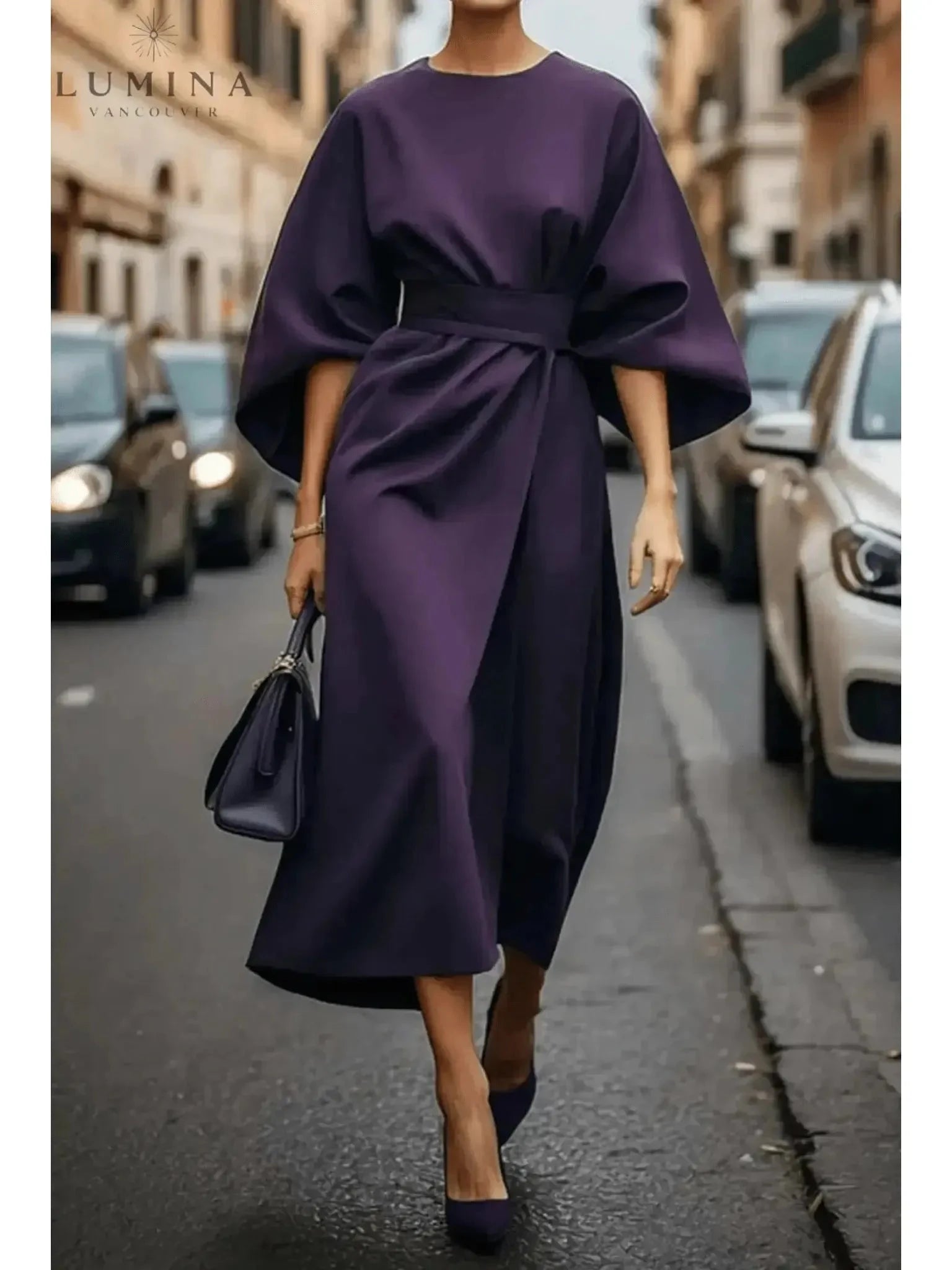 Navy blue Sonia elegant dress by Lumina Vancouver featuring a stylish belt, displayed on a mannequin.