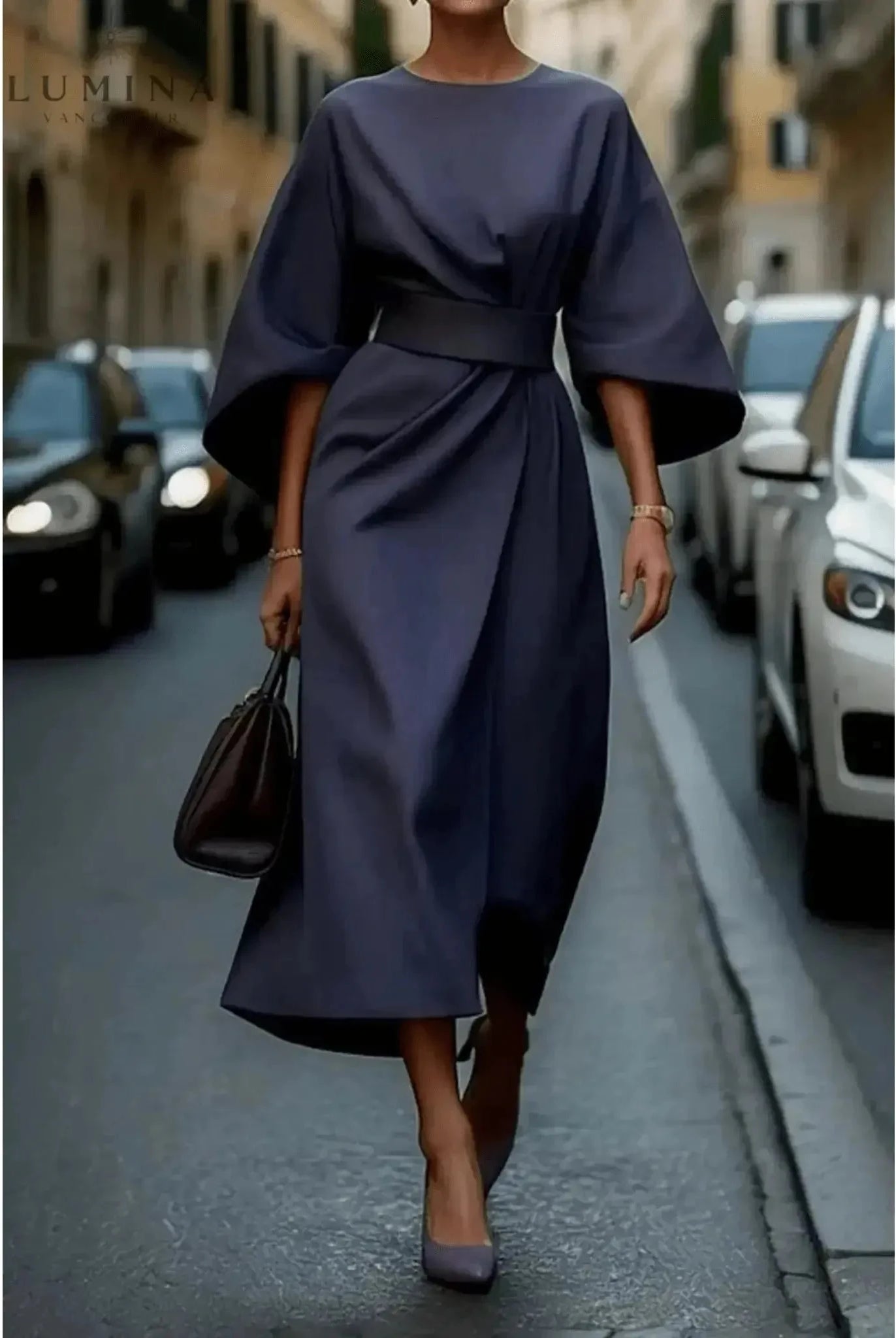 Navy blue Sonia elegant dress with belt by Lumina Wear, featuring a fitted silhouette and stylish waist detail.