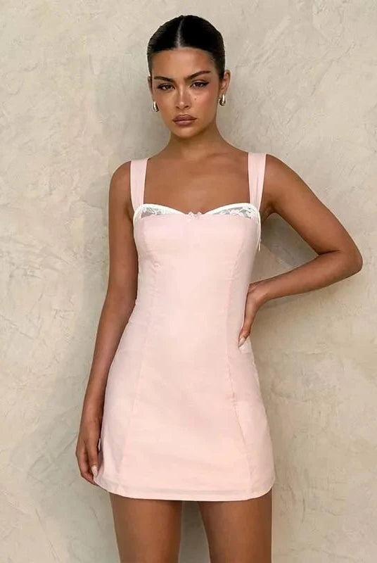 Pink satin mini dress with lace trim by Lumina Wear, featuring a fitted silhouette and delicate lace details.
