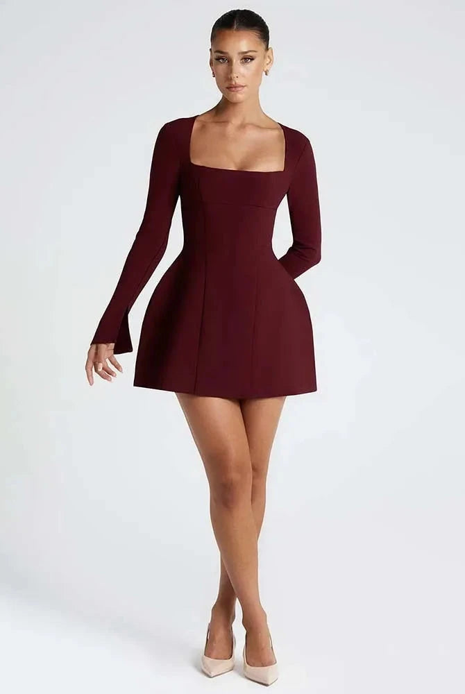 Red Lumina Wear Aria women's mini dress with fit and flare silhouette, showcasing a stylish and vibrant design.
