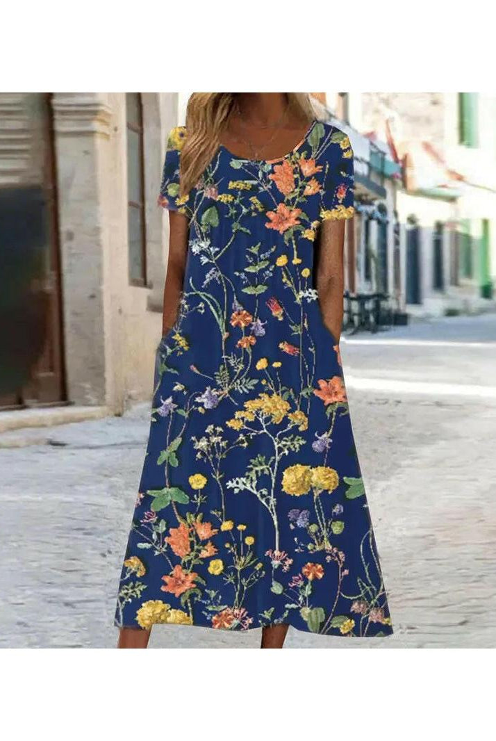 Lumina Wear Alya boho floral maxi dress with tummy coverage, flowing fabric, and vibrant red floral pattern, perfect for elegant summer wear.