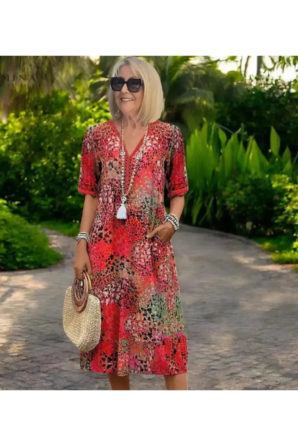 Red Isla Spring Dress by Lumina Vancouver, featuring lightweight fabric and a flowy design, perfect for warm weather.