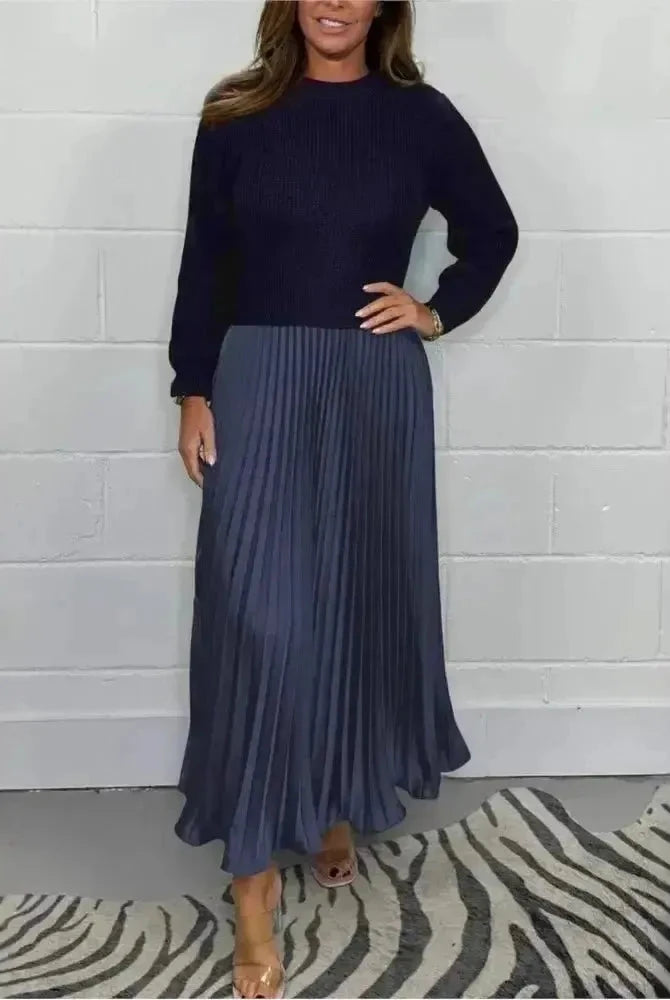 Sky blue Mariana long-sleeved dress by Lumina Wear, displayed on a mannequin with flowing fabric and elegant design.