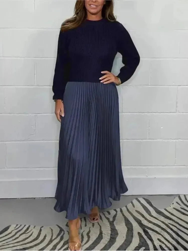 Sky blue Mariana long-sleeved dress by Lumina Wear, displayed on a mannequin with flowing fabric and elegant design.