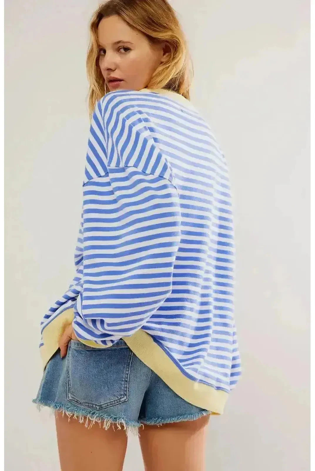 Sky blue oversized fall sweater by Lumina Wear with a cozy, relaxed fit and soft knit fabric.
