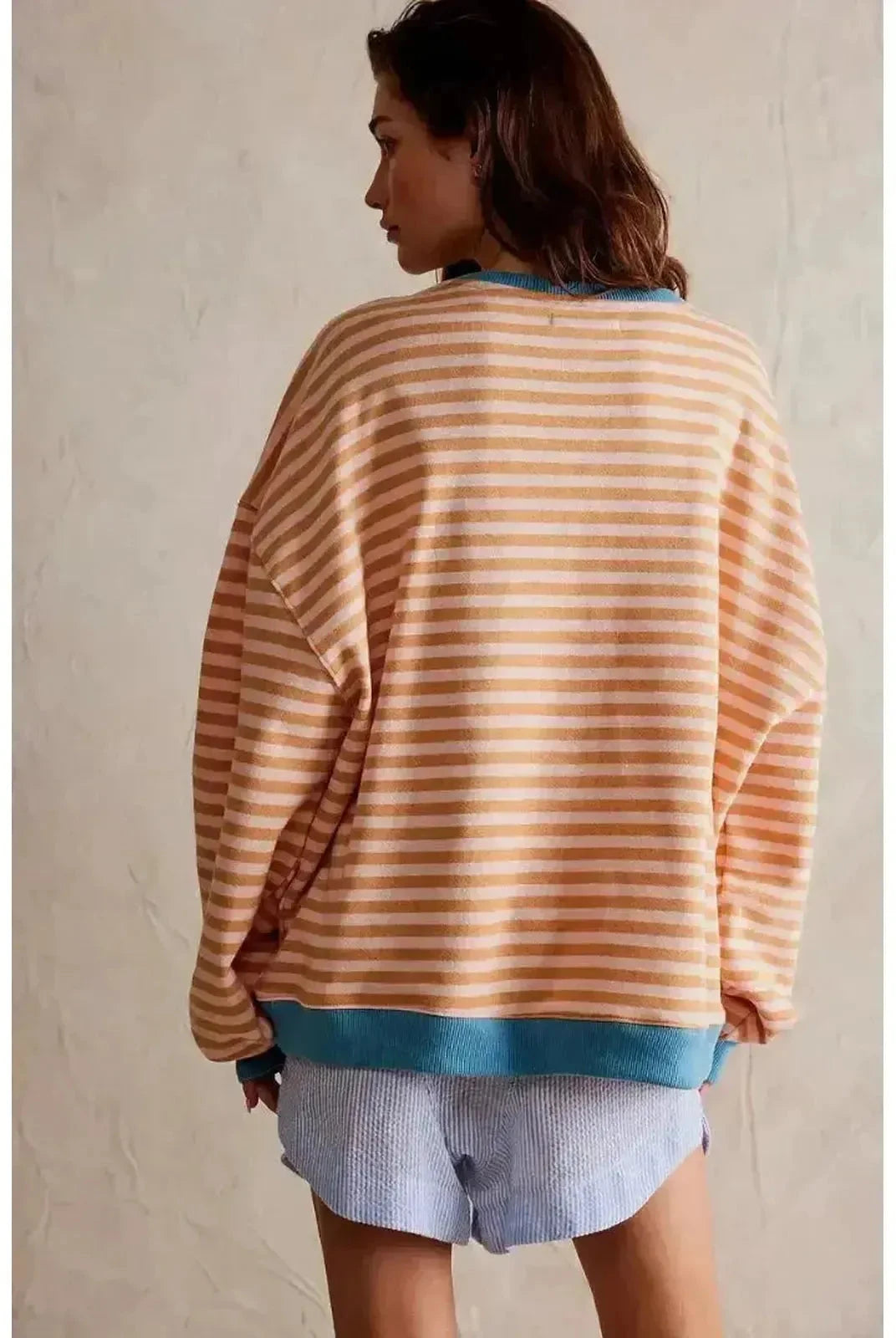 Sky blue oversized fall sweater by Lumina Wear, featuring a cozy, relaxed fit and soft knit fabric for casual autumn wear.