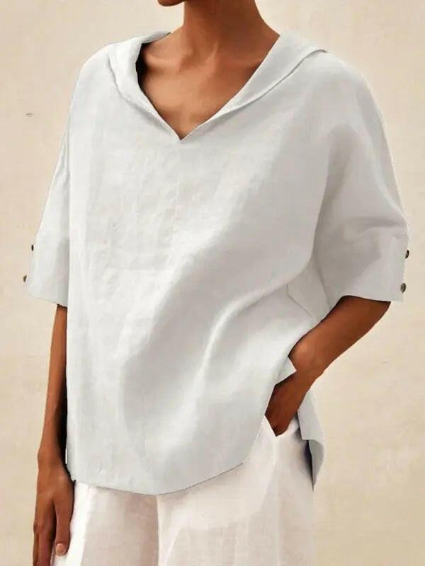Blue women's casual V-neck shirt by Lumina Vancouver, displayed flat with soft fabric and relaxed fit.