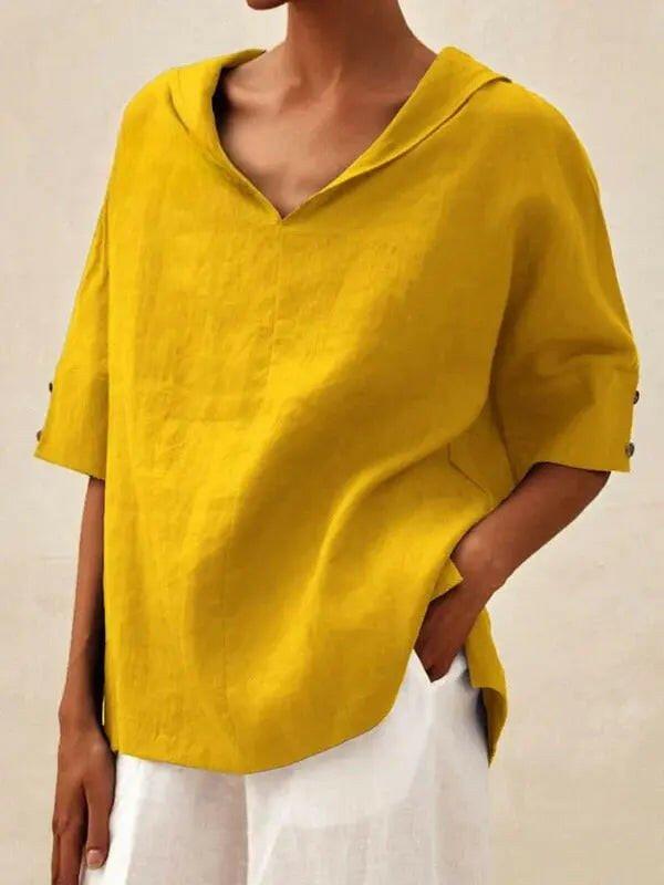 Blue women's casual V-neck shirt by Lumina Vancouver, featuring a comfortable relaxed fit and soft fabric for everyday wear.