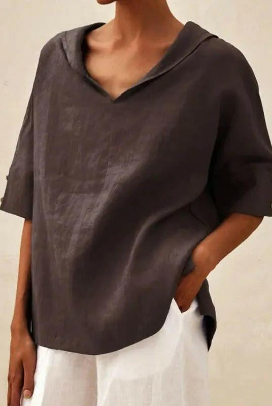 Blue women's casual V-neck blouse by Lumina Wear, featuring a relaxed fit and soft fabric, perfect for everyday wear.