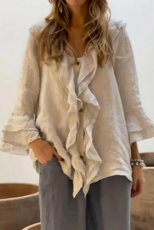 Women's ruffle blouse by Lumina Wear featuring casual cotton fabric and 3/4 sleeves, in blue with stylish ruffle details.
