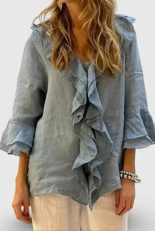 Light blue women's cotton blouse with ruffles and 3/4 sleeves by Lumina Wear, casual and comfortable for everyday wear.