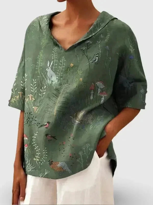 Women's casual V-neck shirt by Lumina Vancouver with woodland and animal print pattern, in green, perfect for everyday wear.