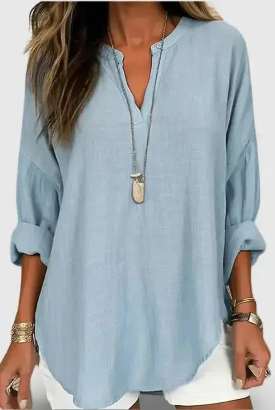 Light-blue women's cotton long sleeve blouse by Lumina Wear featuring a round neck and loose fit, perfect for beachwear.