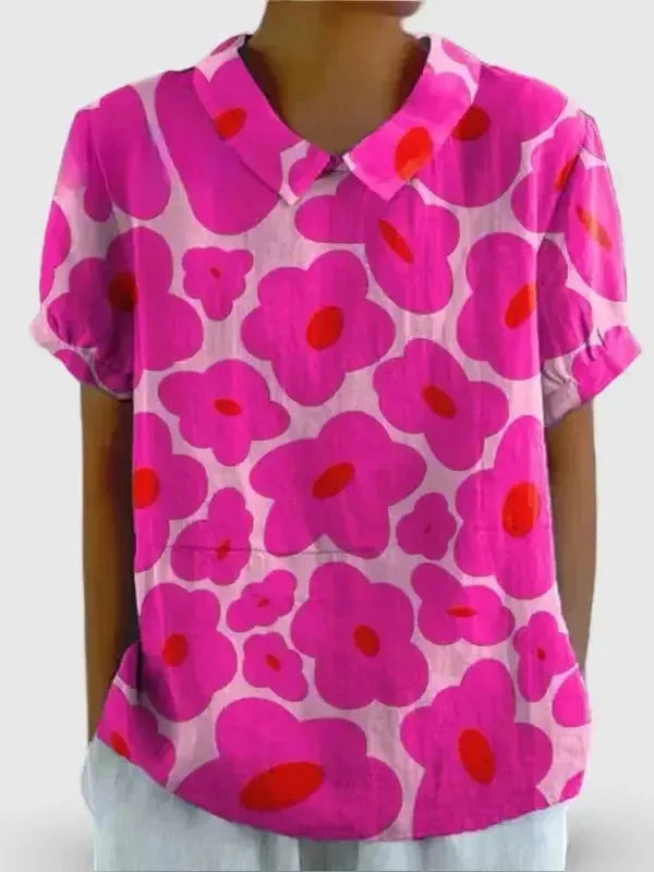 Vibrant pink floral printed women's casual cotton shirt by Lumina Vancouver, showcasing a relaxed fit and bright floral pattern.