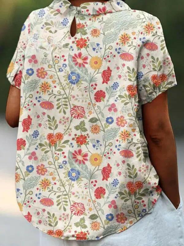 Women's casual cotton shirt with pastoral floral art print by Lumina Vancouver, featuring a relaxed fit and vibrant floral design.