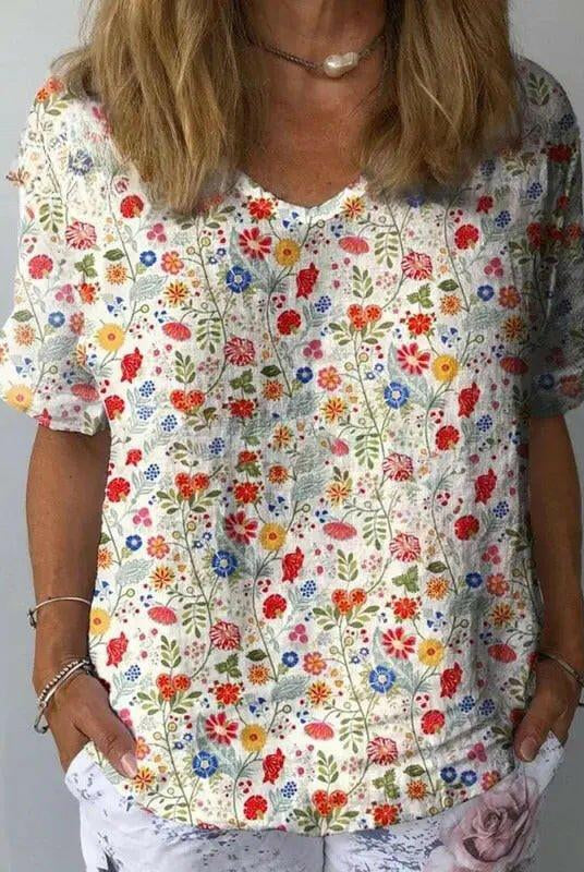Women's casual cotton blouse with pastel floral art print by Lumina Wear, featuring a relaxed fit and soft fabric.