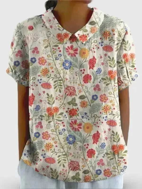 Women's casual cotton shirt with pastoral floral art print by Lumina Vancouver, featuring a relaxed fit and vibrant floral design.