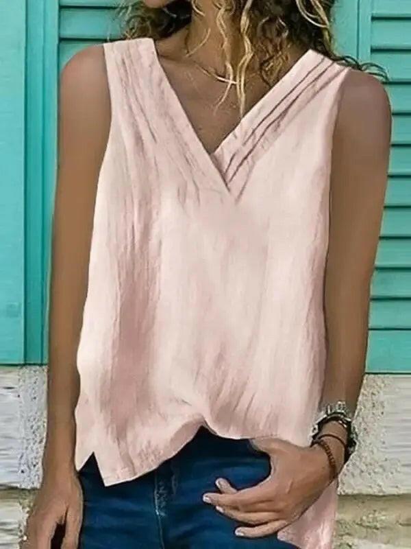 Women's white V-neck sleeveless shirt with hem split by Lumina Vancouver, stylish and comfortable for casual wear.