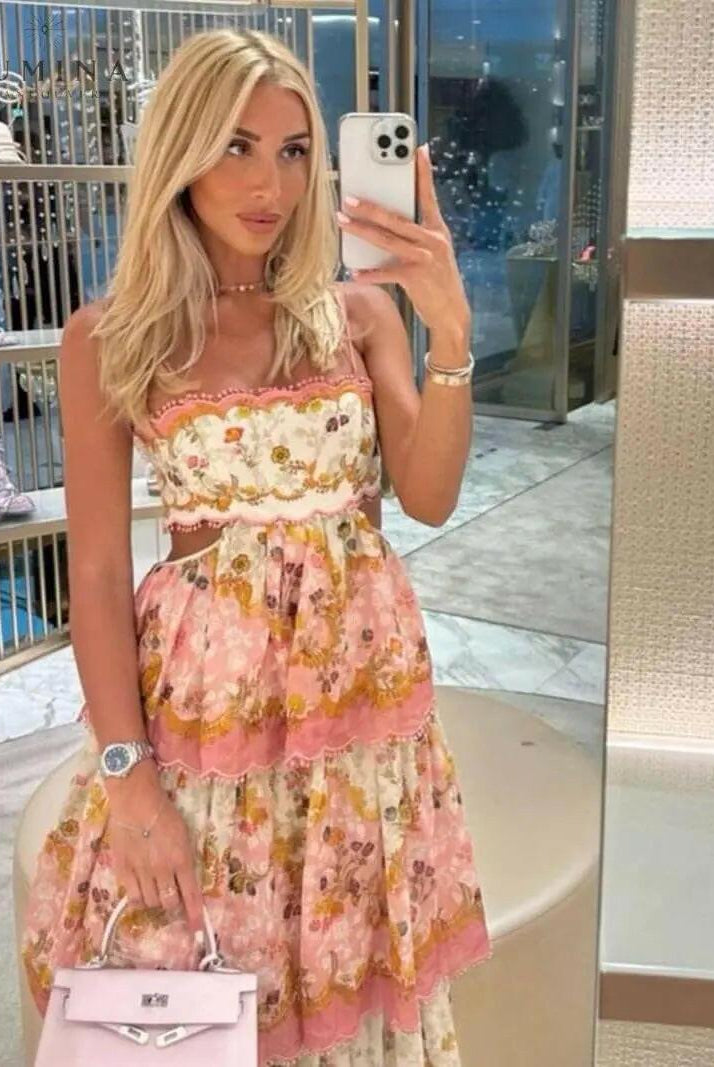 Lumina Wear Ghita Maxi Summer Dress featuring a flowy design and vibrant floral pattern, perfect for warm-weather occasions.