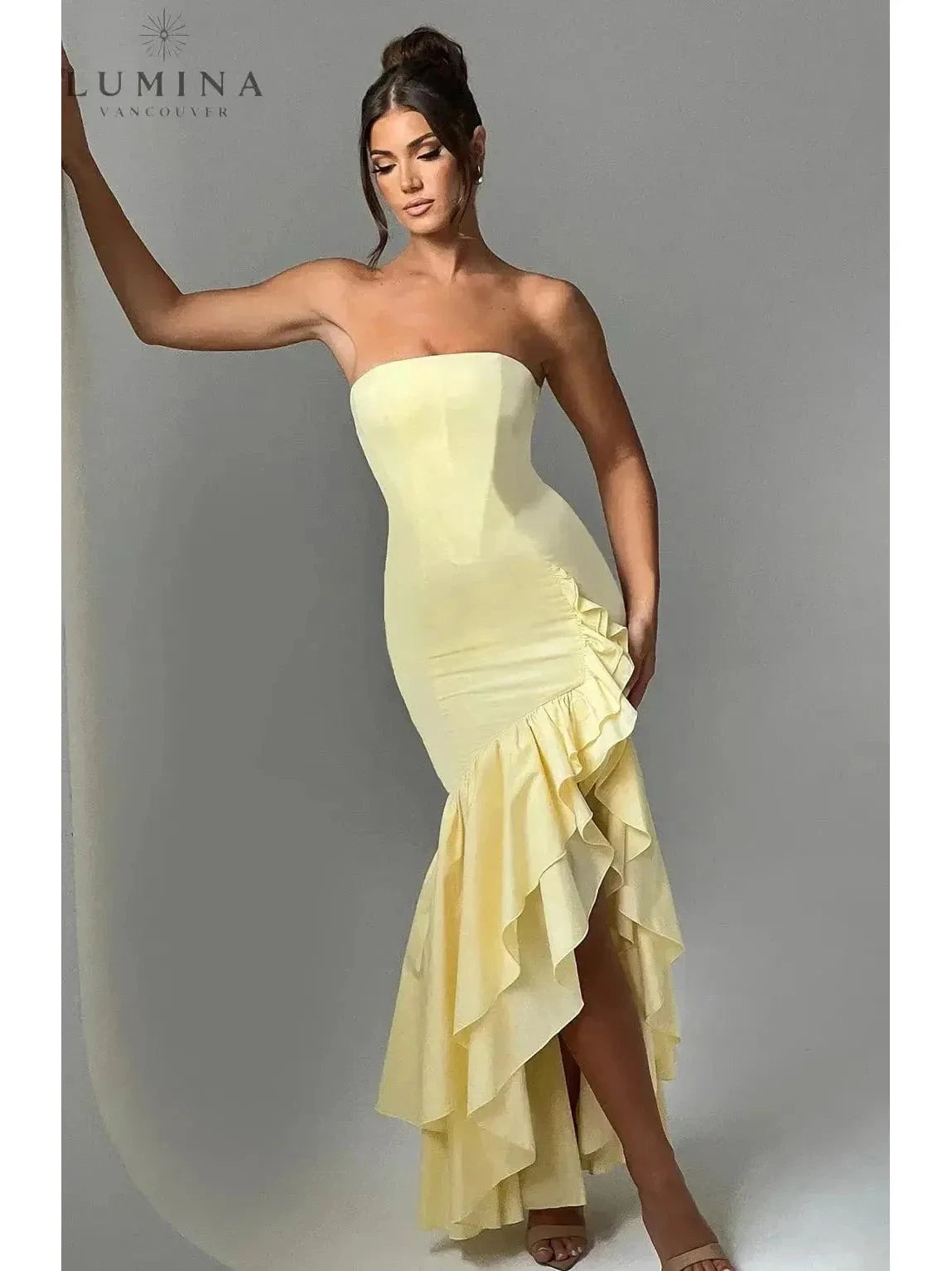 Blue floral sleeveless Riviera maxi dress with slit and ruffle details, ideal for wedding guests by Lumina Wear.