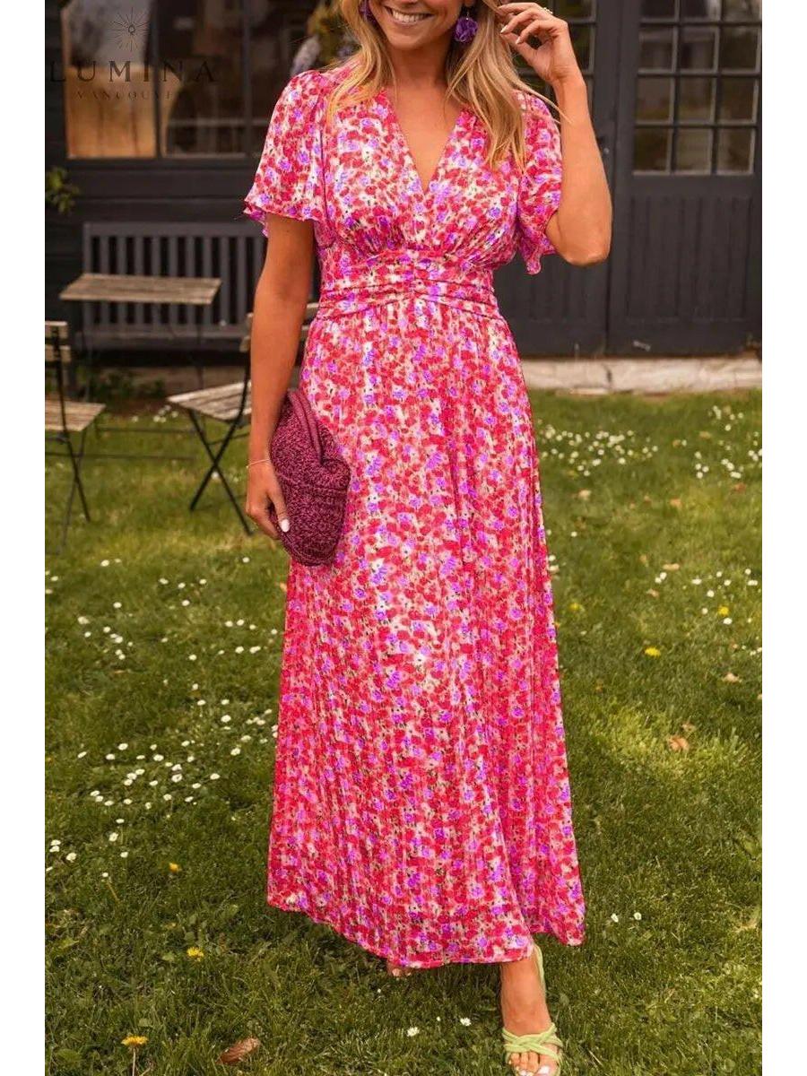 Orange Isabella maxi dress by Lumina Vancouver, elegant wedding guest dress with flowy fabric and sophisticated style.