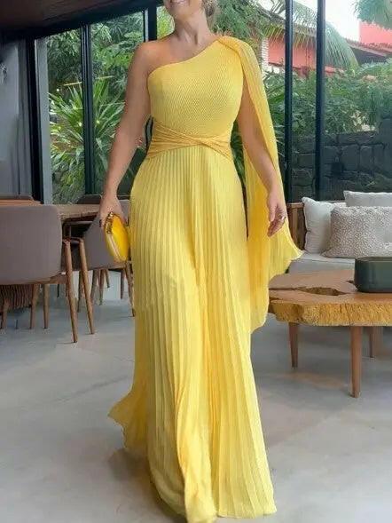 Yellow Dalila off-shoulder pleated maxi dress by Lumina Vancouver, perfect for wedding guest attire, shown on a model.