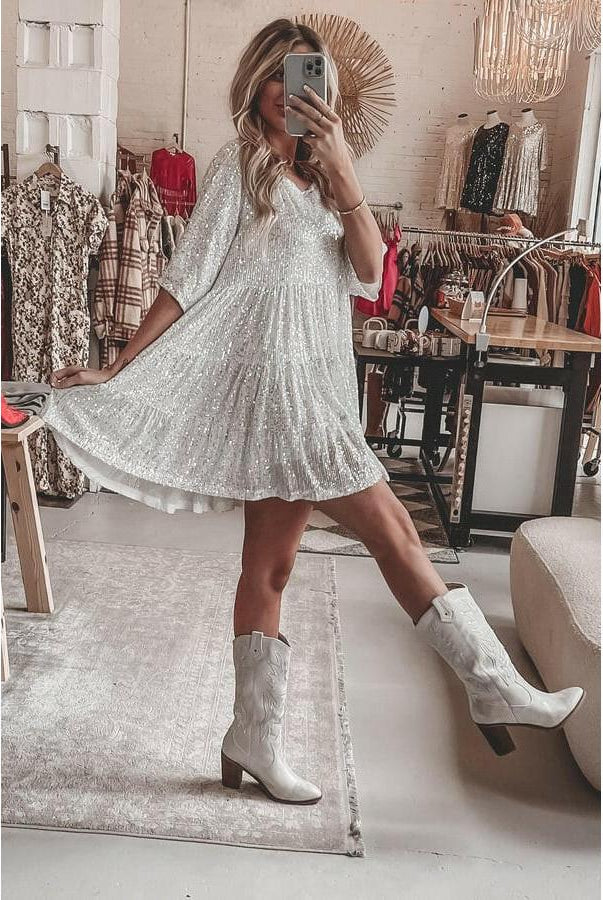 Luminette™ sparkling mini dress in white and silver, featuring a fitted silhouette and shimmering fabric.
