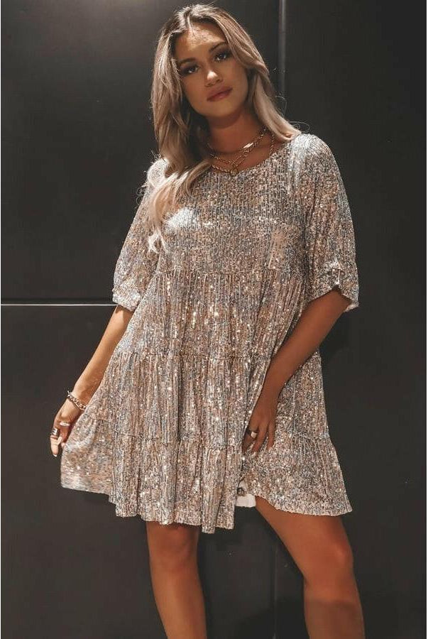 Luminette™ Sparkling Mini Dress in white and silver, Lumina Vancouver, showcasing the elegant, shimmering fabric and stylish fit.