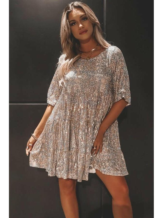 Luminette™ Sparkling Mini Dress in white and silver, Lumina Vancouver, showcasing the elegant, shimmering fabric and stylish fit.