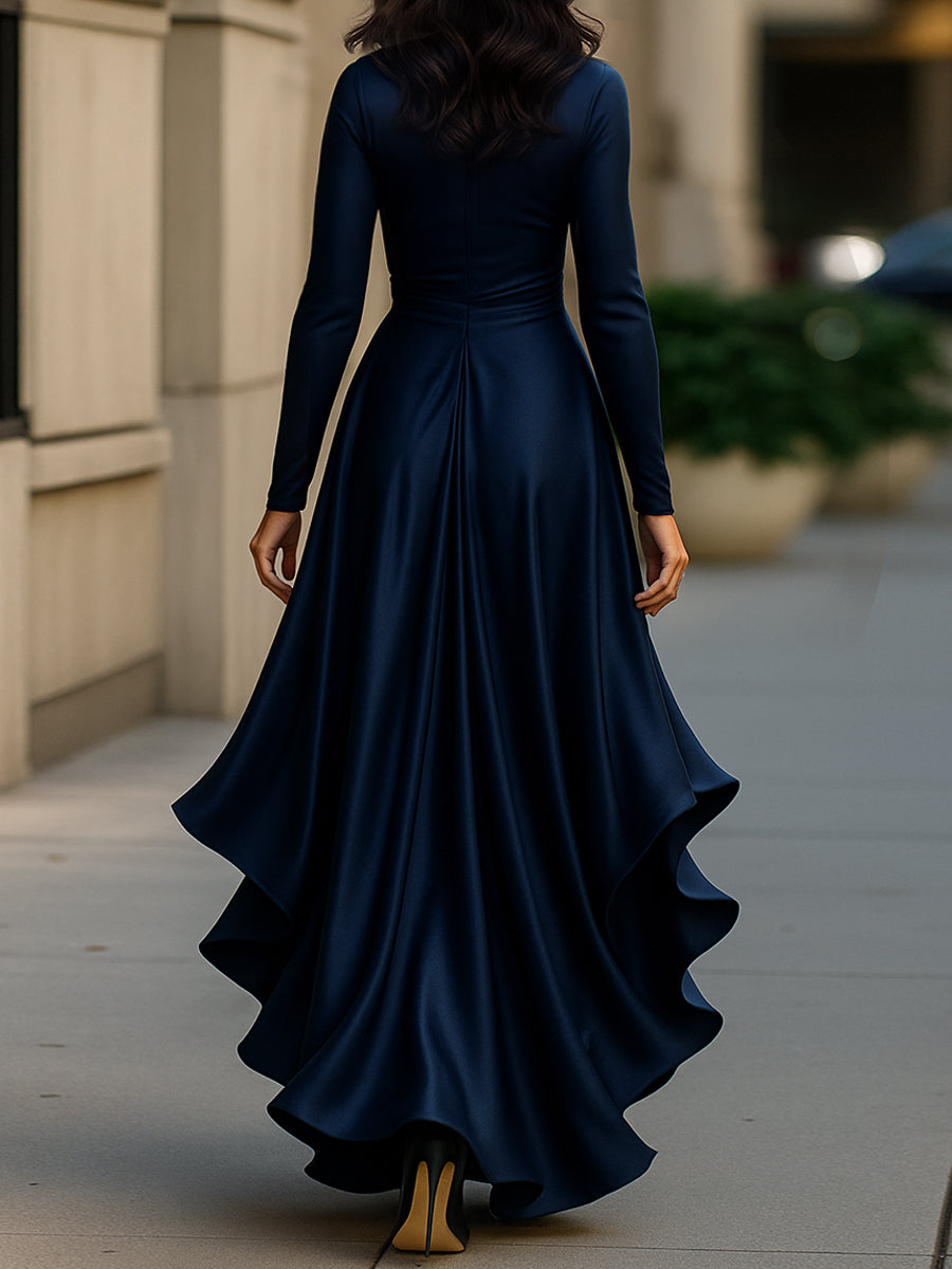 Navy blue Adriene satin maxi dress with ruffle hem by Lumina Wear, shown on model, featuring elegant flowing fabric and stylish design.