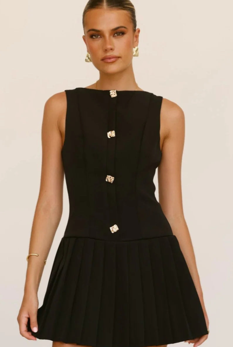 Black Luna sheer high-neck pleated dress by Lumina Vancouver, showcasing a flowing, elegant design with a high neckline and pleats.
