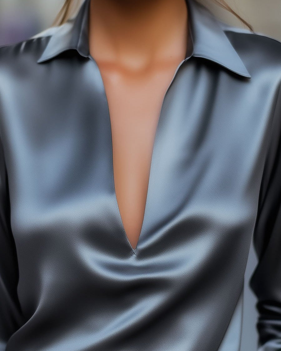 Silver satin Luna V-neck blouse by Lumina Wear, featuring a stylish V-neck and elegant fit, shown on a model.