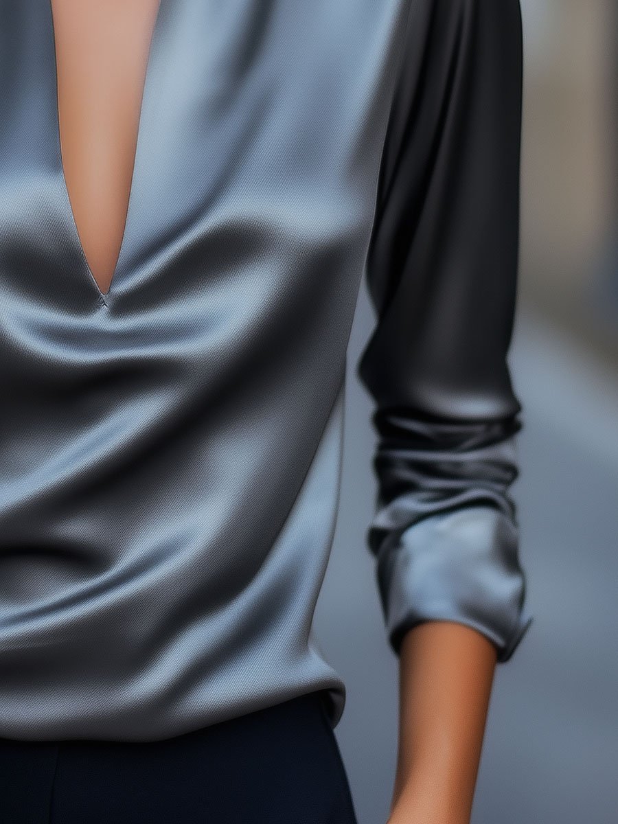Silver satin V-neck blouse by Lumina Vancouver, shown in size XS with elegant drape and smooth fabric.