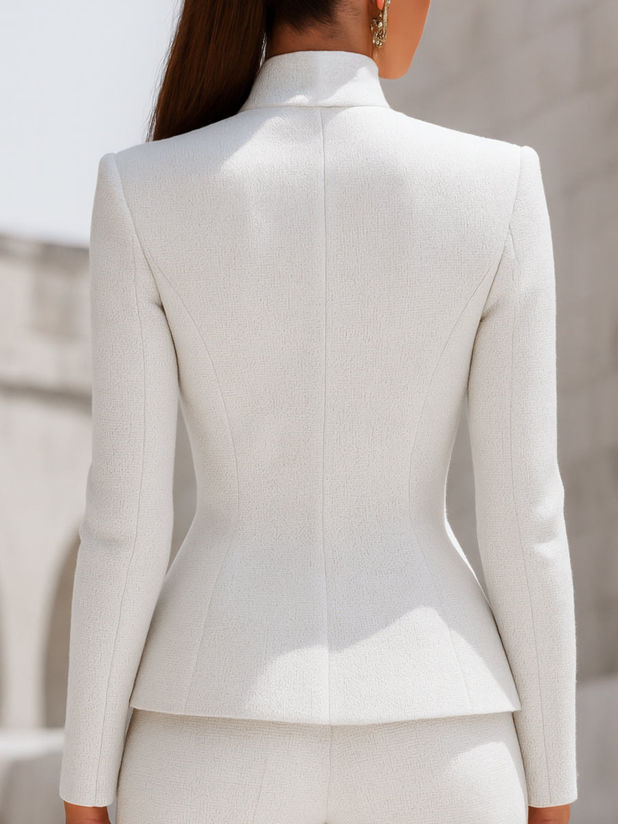 Lumina Wear Harriet white blazer with stand collar, peplum style, gold button details, shown on a model.