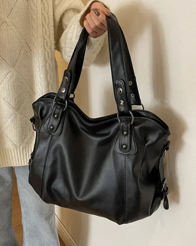 Lumina Wear Lunelle black handbag with spacious interior and versatile strap, stylish for everyday use.