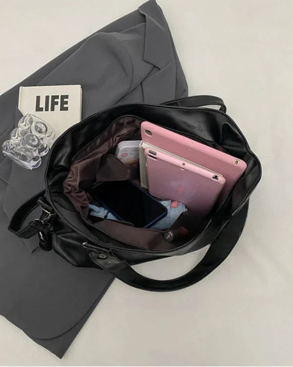Lumelle black handbag by Lumina Wear featuring a spacious design and versatile strap, suitable for daily or evening use.