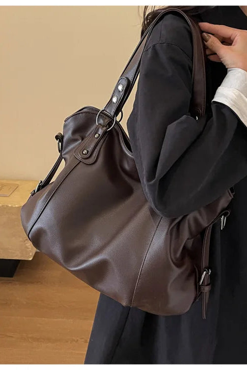 Lumina Wear Lunelle black handbag with spacious interior and versatile strap, stylish accessory for everyday use.