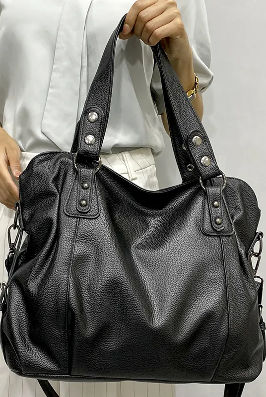 Lumina Wear Lunelle black handbag with spacious interior and versatile strap, perfect for everyday use.