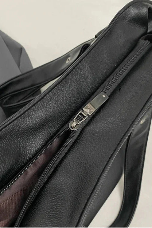 Lumina Wear Lunelle black handbag with spacious interior and versatile strap, perfect for everyday use and stylish occasions.