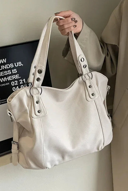 Lumina Wear Lunelle black handbag with spacious interior and versatile strap, stylish accessory for everyday use.