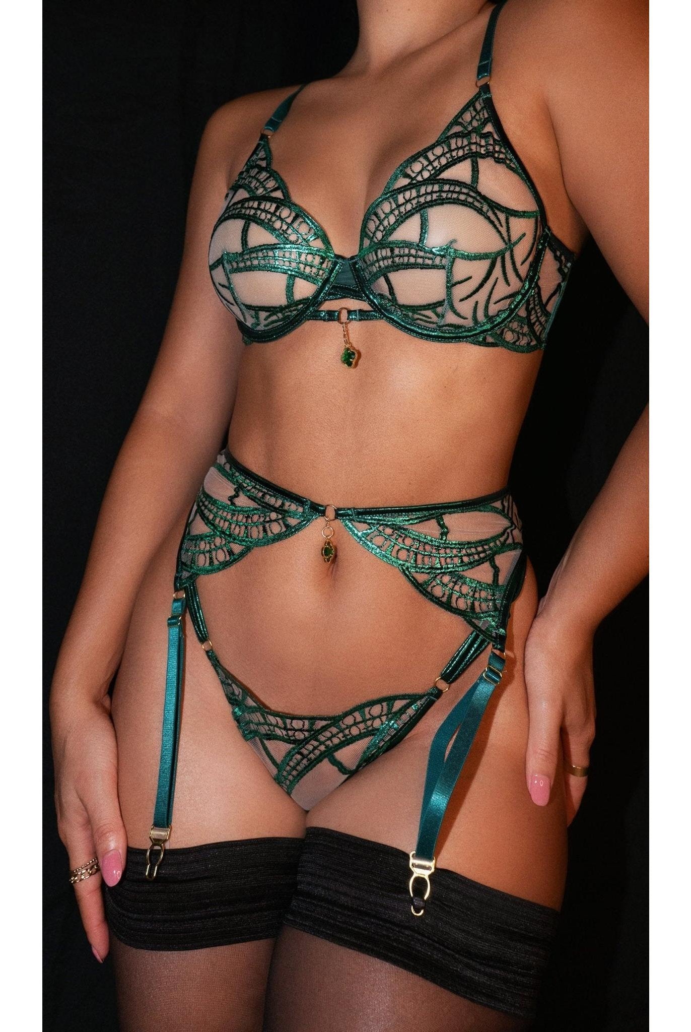 Luxe green metallic foil lace lingerie set by Lumina Wear, includes bra, panties, and garter belt, with shiny metallic details.