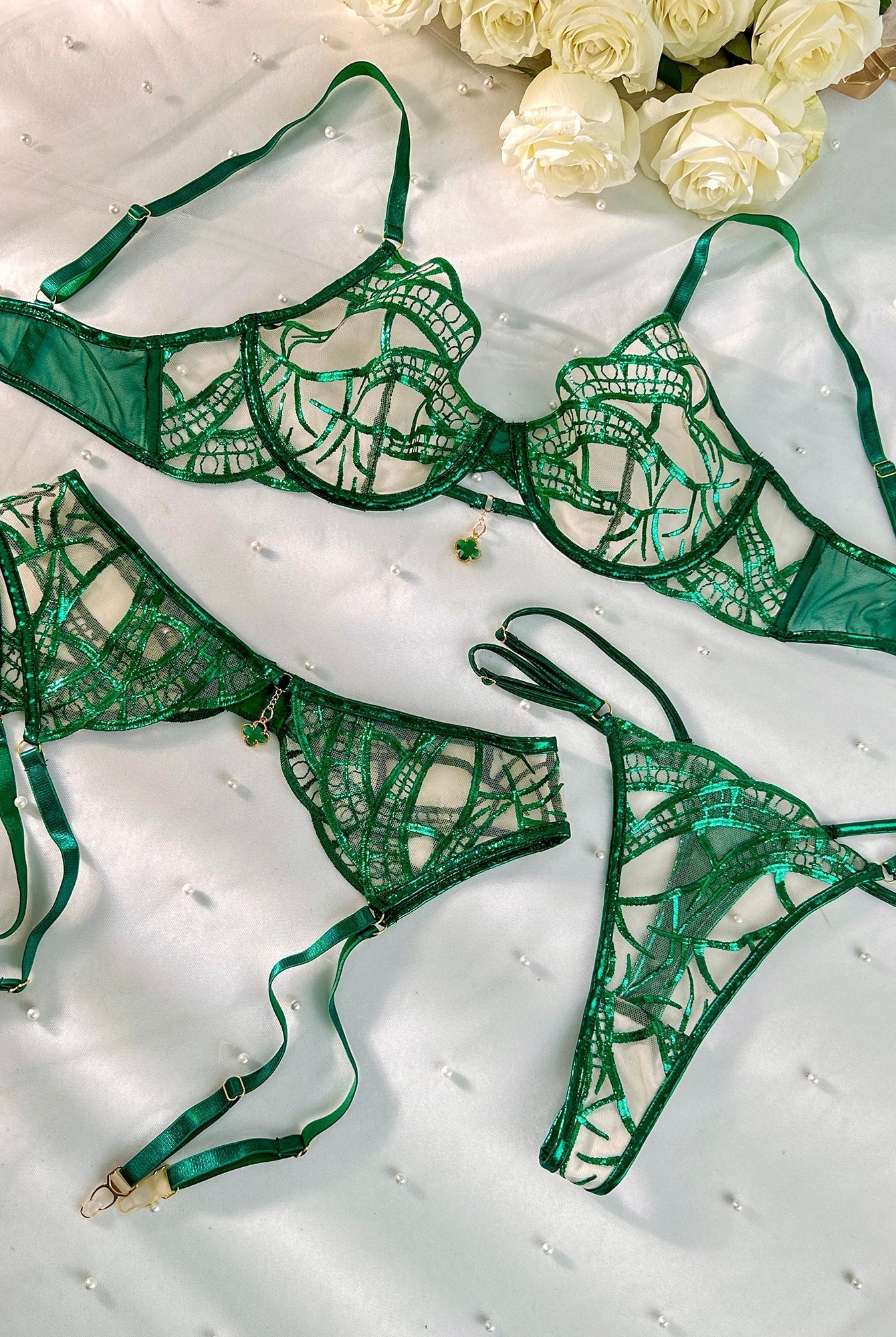 Luxe green metallic foil lace lingerie set by Lumina Wear, includes bra, panties, and garter belt, featuring shiny metallic details.