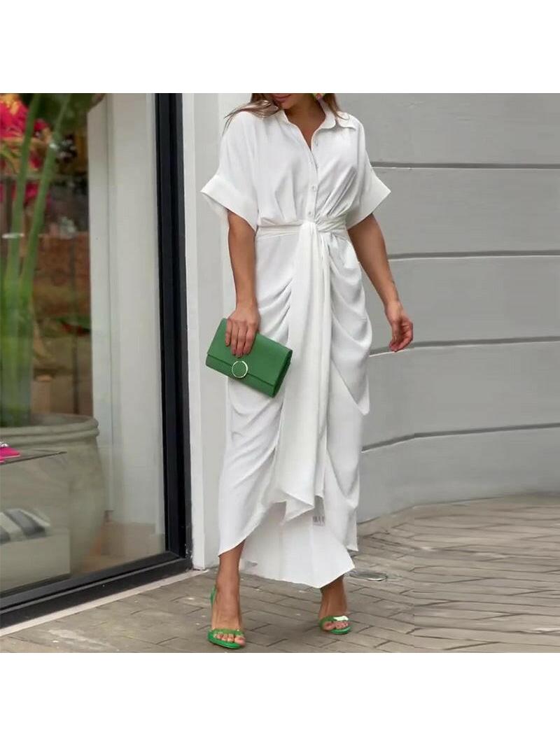 Elegant green Lyla™ casual dress by Lumina Vancouver, displayed on a hanger, showcasing a stylish, flowing design.
