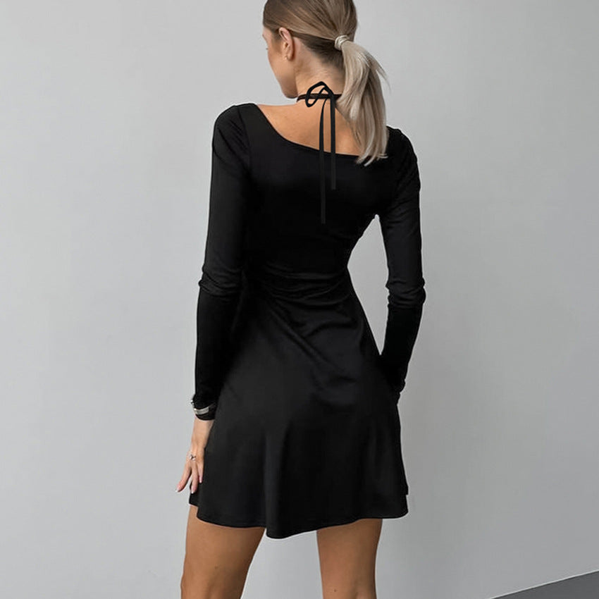 Black Lyra A-line dress with square neckline by Lumina Vancouver, featuring a mini length and elegant fit.