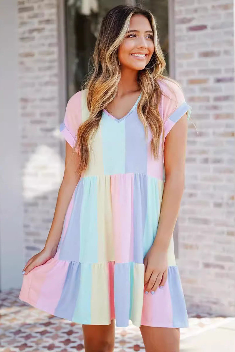 Multicolor Lyra casual tiered knee-length mini dress by Lumina Vancouver, flowing fabric with a relaxed fit and vibrant pattern.